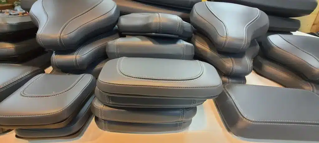 New custom-made upholstery installed on gym machine seat