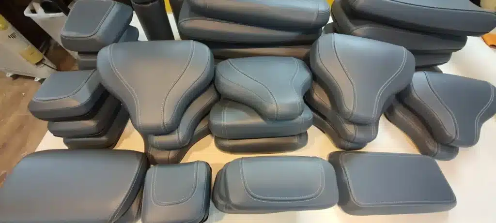 Finished gym equipment pads with leatherette covers
