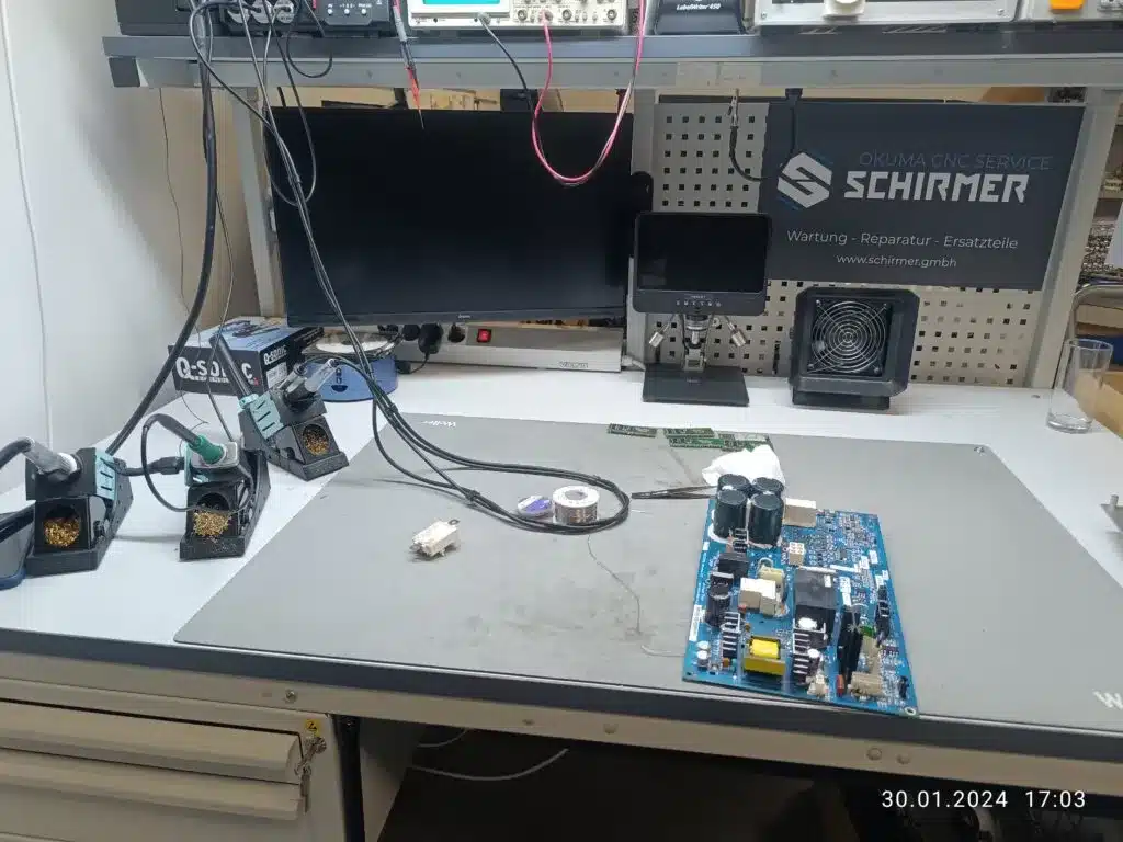 Electronic circuit board under repair at service desk